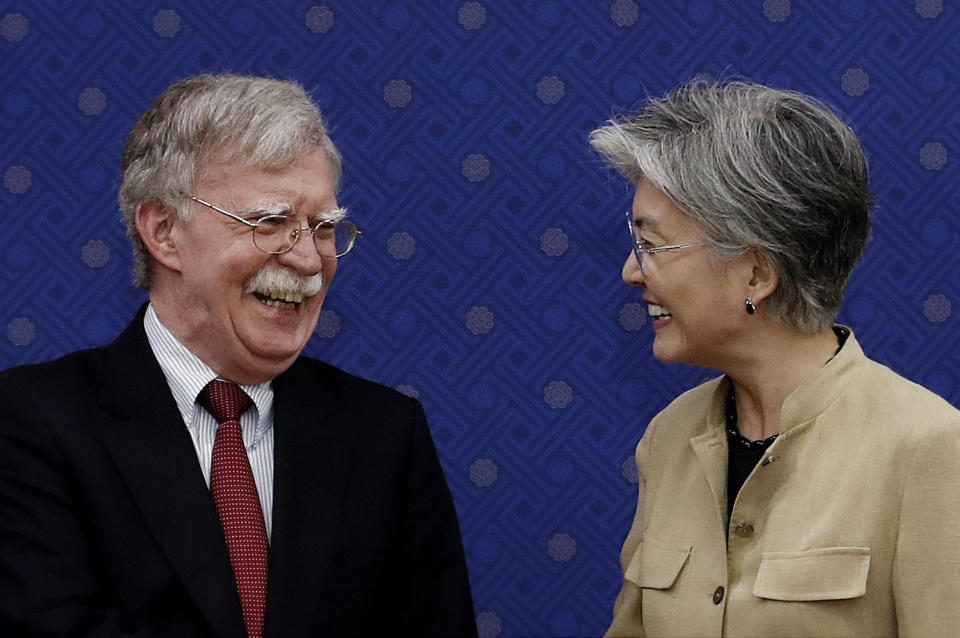 South Korean Foreign Minister Kang Kyung-wha, right, and U.S. National Security Advisor John Bolton smile during a meeting at the foreign ministry in Seoul, South Korea, Wednesday, July 24, 2019. (AP Photo/Ahn Young-joon, Pool)