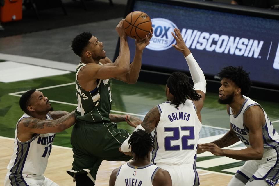 Milwaukee Bucks' Giannis Antetokounmpo shoots during the first half of an NBA basketball game against the Sacramento Kings Sunday, Feb. 21, 2021, in Milwaukee. (AP Photo/Morry Gash)