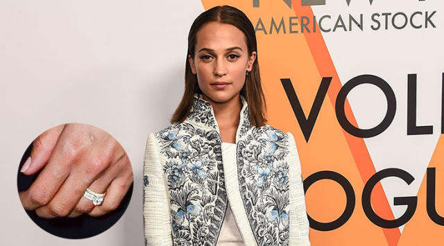 Alicia Vikander flashes her wedding ring as she jets into New York