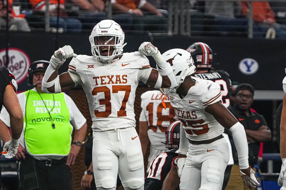 Texas linebacker Morice Blackwell Jr. (37) celebrates a defensive stop against Oklahoma State during the 2023 Big 12 Championship game at AT&T stadium on Saturday, Dec. 2, 2023 in Arlington, Texas.