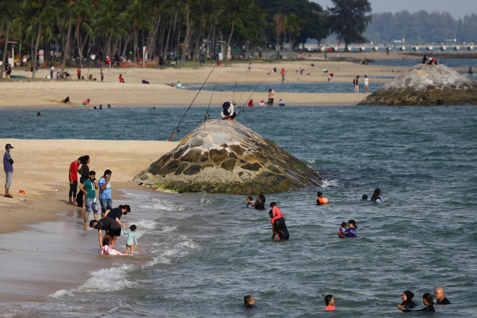 People at a beach at East Coast Park in Singapore.