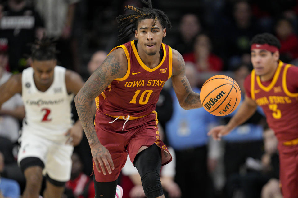 Iowa State's Keshon Gilbert (10) controls the ball during the second half of an NCAA college basketball game against Cincinnati, Tuesday, Feb. 13, 2024, in Cincinnati. (AP Photo/Jeff Dean)