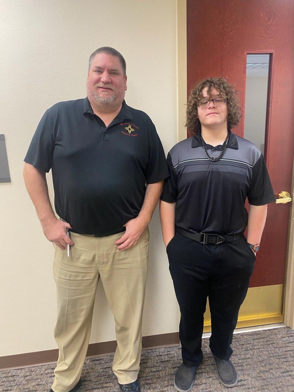 Vista Nueva High School student Brandon Gallegos, right, an intern at the Aztec District Court/Aztec Magistrate Court, poses with his mentor, David Baker.