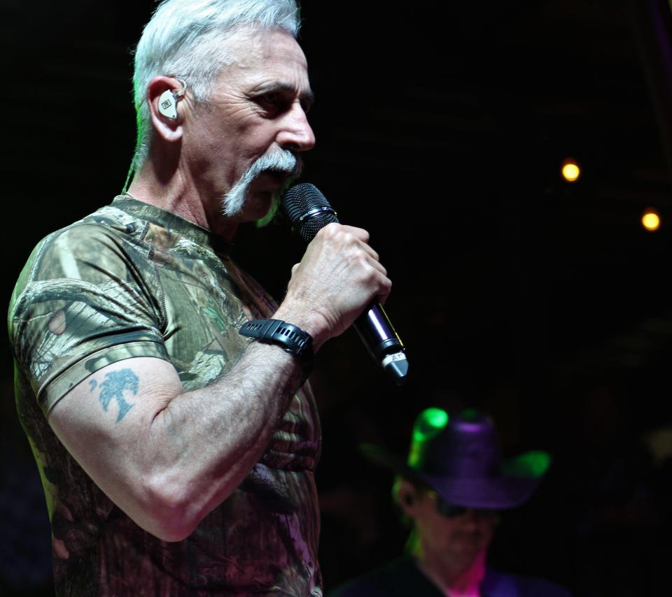 Singer Aaron Tippin is a light grayer but he still has muscular arms. Tippin joined Sammy Kershaw on stage as Friday night headliners at the 11th Outlaws & Legends Music Festival. March 25 2022