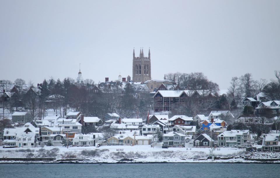 The chapel at St. George's School stands high above the snow-covered homes along the water in Middletown on Jan. 7, 2022.