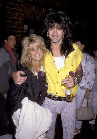 <p>Ron Galella/Ron Galella Collection</p> Heather Locklear and Tommy Lee in 1986