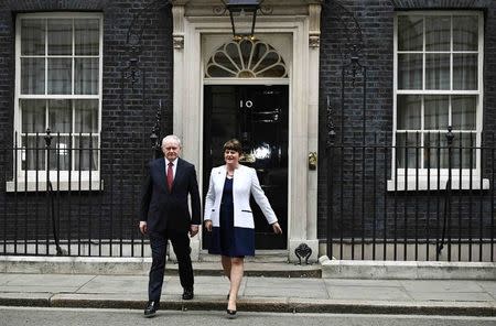 FILE PHOTO - Arlene Foster (R) and Martin McGuinness, First and Deputy First Ministers of Northern Ireland leave Number 10 Downing Street in London, Britain October 24, 2016. REUTERS/Dylan Martinez/File Photo