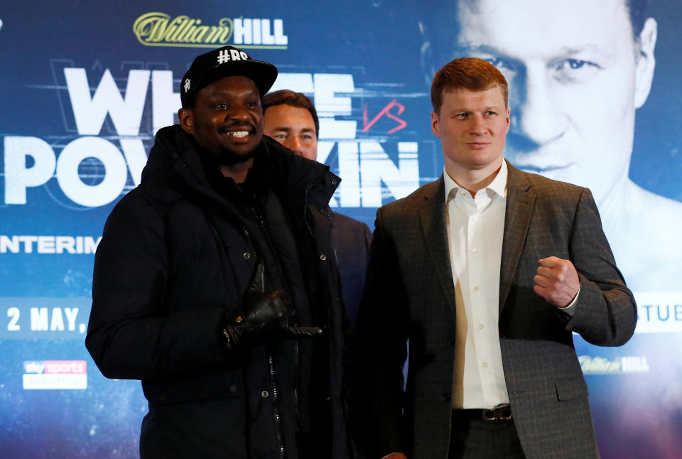 Boxing - Dillian Whyte & Alexander Povetkin Press Conference - Mercure Manchester Piccadilly Hotel, Manchester, Britain - March 4, 2020   Dillian Whyte and Alexander Povetkin pose with promoter Eddie Hearn after the press conference   Action Images via Reuters/Jason Cairnduff