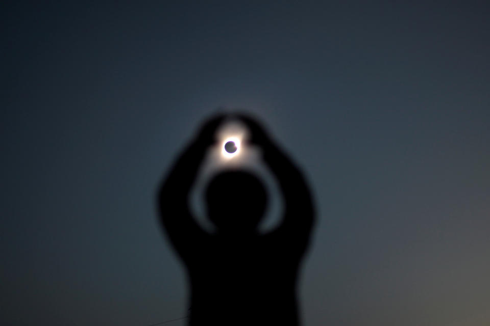 A person gestures while observing a solar eclipse at Incahuasi, Chile, July 2, 2019. (Photo: Juan Jose Gonzalez Galaz/Reuters)