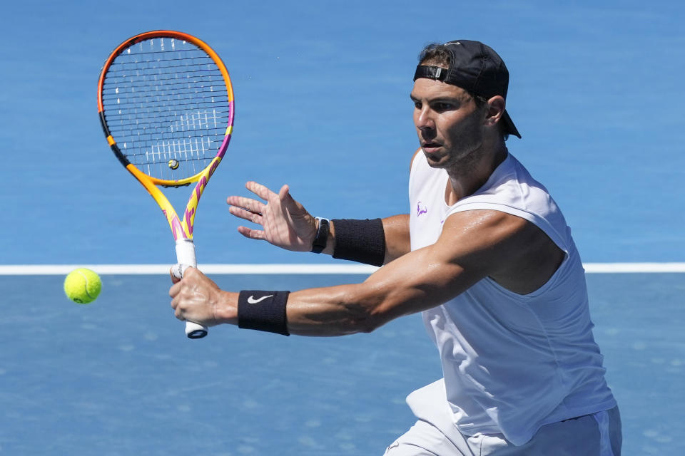 Spain's Rafael Nadal hits a backhand during a practice session on Rod Laver Arena ahead of the Australian Open at Melbourne Pack, Australia, Wednesday, Jan. 12, 2022. (AP Photo/Mark Baker)