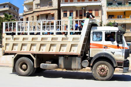 Residents flee Jisr al-Shughour town after rebels took control of the area April 25, 2015. REUTERS/Ammar Abdullah