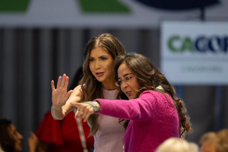 South Dakota Gov. Kristie Noem is embraced by a supporter before speaking at the CAGOP Convention on Saturday at the Hyatt Regency Airport hotel in Burlingame.