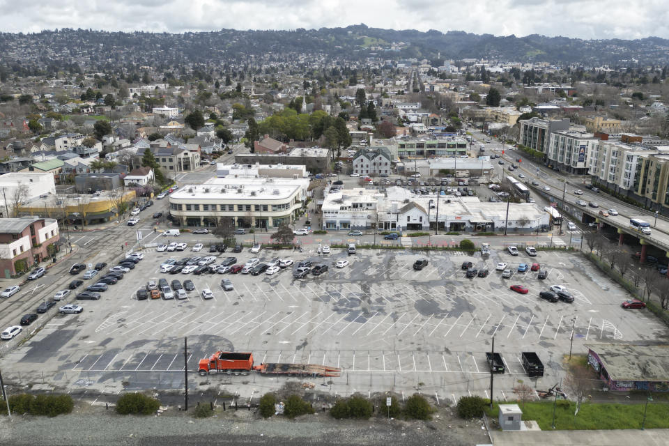 An aerial view is a parking lot that was once the Shellmound village site in Berkeley, Calif., Tuesday, March 12, 2024. The Berkeley City Council on Tuesday will consider a settlement to return land that once held the Shellmound village site, a ceremonial and burial site, to the Sogorea Te' Land Trust, a Bay Area collective that works to return land to Indigenous people. (AP Photo/Terry Chea)