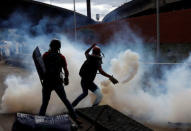 Demonstrators clash with police during rally against Venezuela's President Nicolas Maduro in Caracas, Venezuela May 1, 2017. REUTERS/Carlos Garcia Rawlins