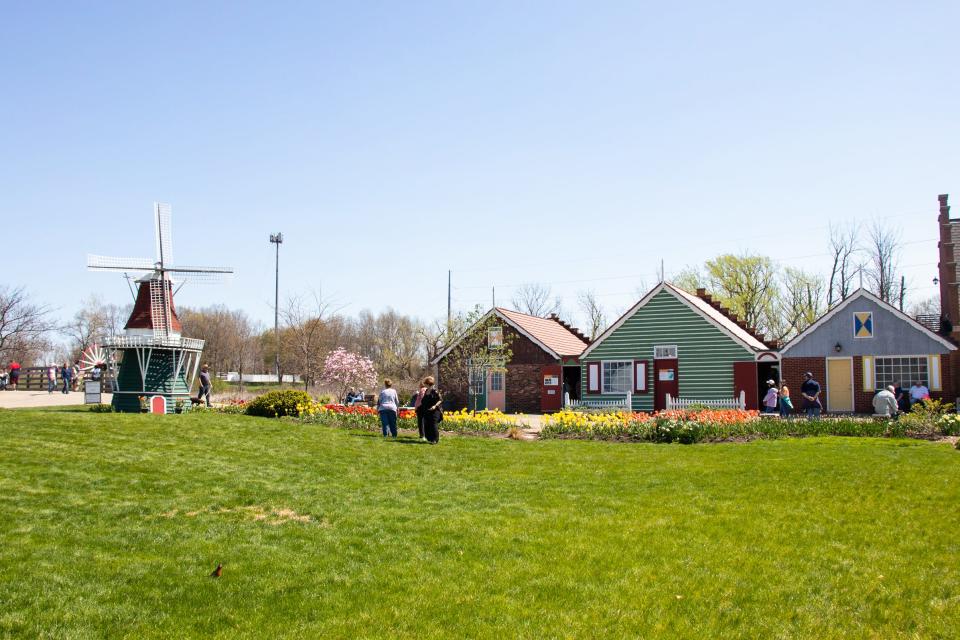 A row of houses next to a small windmill