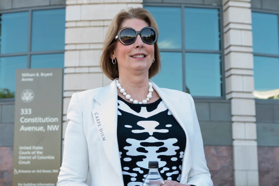 Former Trump attorneys Sidney Powell, leaves the Federal Court in Washington, Thursday, June 24, 2021. A federal judge on Thursday appeared skeptical of arguments to dismiss a defamation lawsuit filed by Dominion Voting Systems over baseless 2020 election claims made by Trump allies Sidney Powell, Rudy Giuliani and the MyPillow Guy. (AP Photo/Manuel Balce Ceneta)