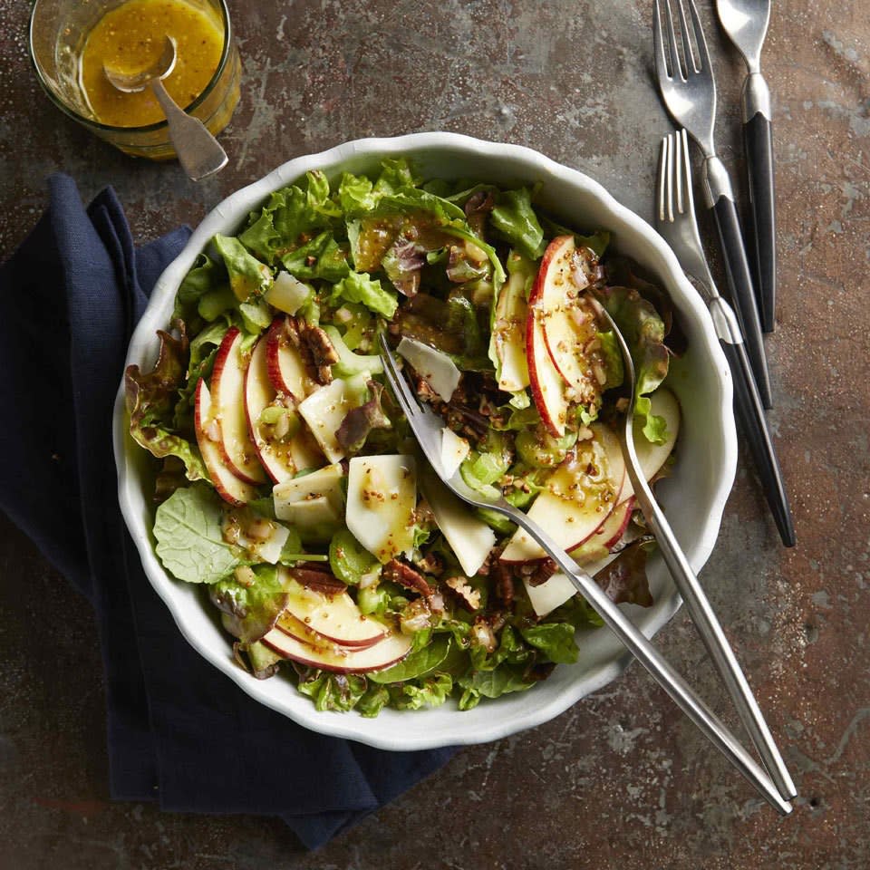 <p>This salad is easy and festive--the perfect healthy addition to your holiday table. The no-sugar-added dressing blends well with the sweet notes of apple and sharp Cheddar cheese, and crunchy pecans round out the dish.</p>