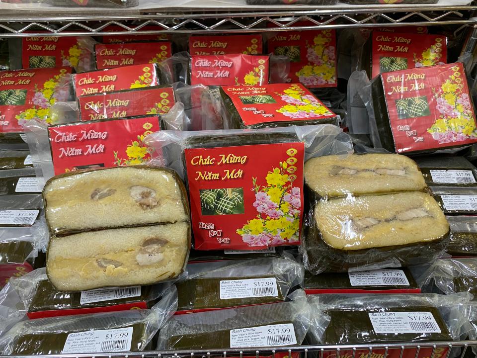Banh Chung, the square shaped rice cake traditionally shared during Tet, and Banh Tet, its log shaped counterpart, can both be purchased at Super Cao Nguyen grocery store in Oklahoma City.