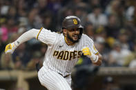 San Diego Padres' Fernando Tatis Jr. runs as he lines out during the sixth inning of a baseball game against the Atlanta Braves, Friday, Sept. 24, 2021, in San Diego. (AP Photo/Gregory Bull)