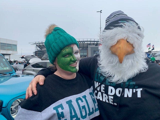 Eagles fans Casey and Mike Mahles of Yardley, Pennsylvania, enjoy some pregame tailgating outside Lincoln Financial Field Sunday.