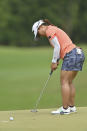 Nasa Hataoka of Japan putts on the 18th green during the final round of the LPGA Honda Thailand golf tournament in Pattaya, southern Thailand, Sunday, May 9, 2021. (AP Photo/Kittinun Rodsupan)