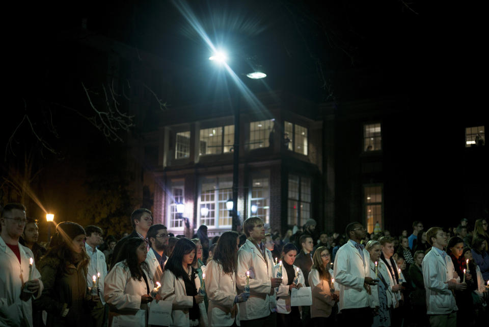 A woman holds a candle during a vigil at the University of North Carolina following the murders of three Muslim students on February 11, 2015 in Chapel Hill, North Carolina. Craig Stephen Hicks, 46, has been charged with three counts of first-degree murder after the February 10, 2015  slayings in the North Carolina university town of Chapel Hill which sparked outrage amongst Muslims worldwide.  Police investigating the murders said they were studying whether the fatal shootings were religiously motivated, as calls mounted for the killings to be treated as a hate crime. (Brendan Smialowski/AFP/Getty Images)