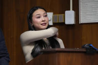 Kylie Ossege describes her bullet exit wound during her impact statement, Friday, Dec. 8, 2023, in Pontiac, Mich. Parents of students killed at Michigan's Oxford High School described the anguish of losing their children Friday as a judge considered whether a teenager will serve a life sentence for a mass shooting in 2021. Ethan Crumbley, 17, could be locked up with no chance for parole for killing four fellow students and wounding others. (AP Photo/Carlos Osorio, Pool)
