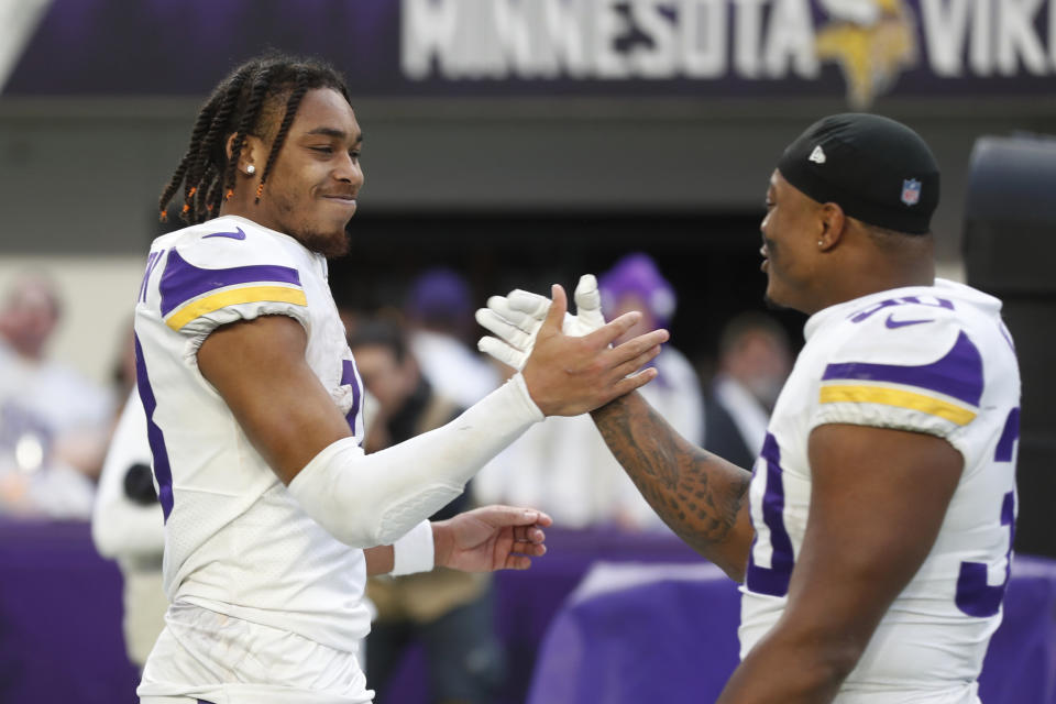 Minnesota Vikings wide receiver Justin Jefferson, left, celebrates with teammate C.J. Ham after an NFL football game against the New York Giants, Saturday, Dec. 24, 2022, in Minneapolis. The Vikings won 27-24. (AP Photo/Bruce Kluckhohn)