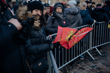 People stand behind a barricade near St Mary's Basilica during the funeral service for the city's mayor Pawel Adamowicz in Gdansk, Poland January 19, 2019. Agencja Gazeta/Bartosz Banka via REUTERS