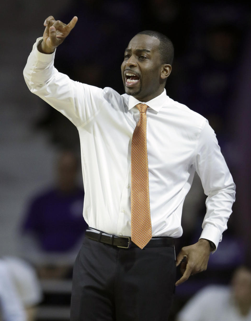 Oklahoma State head coach Mike Boynton, Jr. gestures during the first half of an NCAA college basketball game against Kansas State in Manhattan, Kan., Saturday, Feb. 23, 2019. (AP Photo/Orlin Wagner)