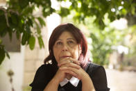 Samira Dajani pauses during an interview at her home, where she has lived since childhood, in the Sheikh Jarrah neighborhood of east Jerusalem, Sunday, May 9, 2021. She and her husband will have to leave it all behind on Aug. 1, when Israel is set to forcibly evict them following a decades-long legal battle waged by ideological Jewish settlers against them and their neighbors. (AP Photo/Maya Alleruzzo)