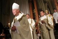 FILE PHOTO: Cardinal Theodore E. McCarrick, retired archbishop of Washington, processes at the beginning of a Mass at the Cathedral Basilica of the Sacred Heart in Newark