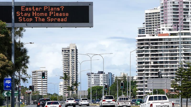 A photo of a road sign in Queensland encouraging people to stay at home this Easter.