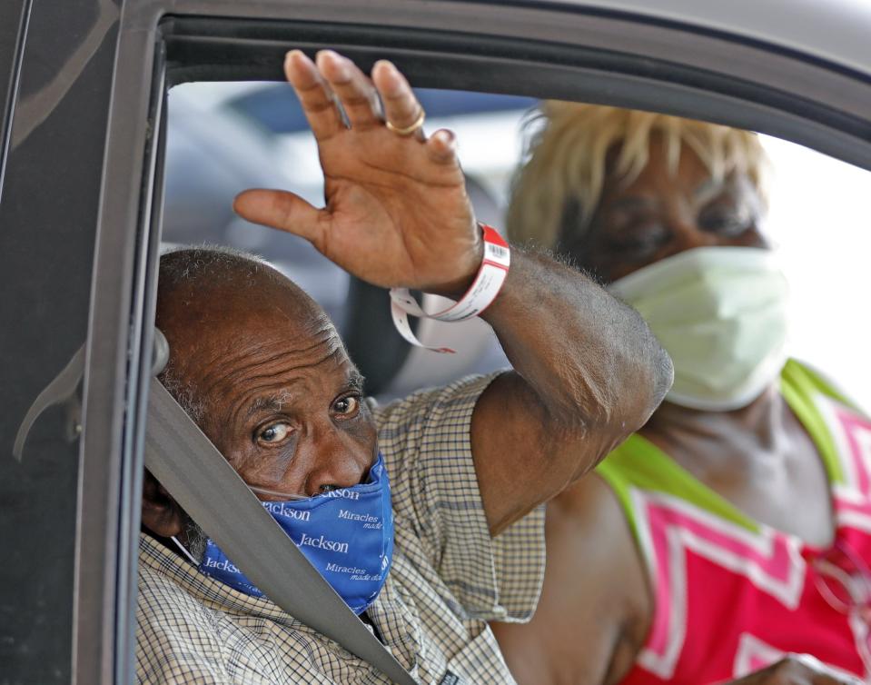 James Gardner, 77, goes home after battling COVID-19 for a month at Jackson South Medical Center, Thursday, Aug. 27, 2020 in Miami. (Al DIaz/Miami Herald via AP)