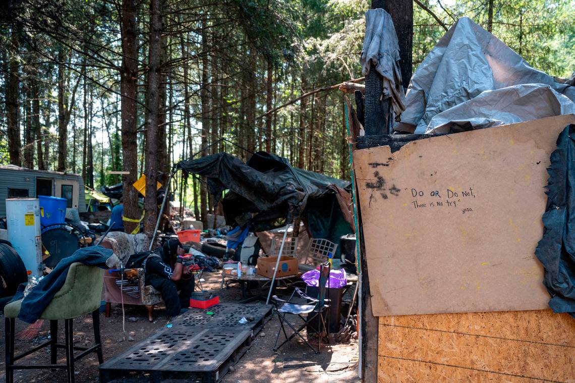 Make-shift shacks and RVs are scattered around the wooded area along the 9700 block of Steele Street South where a medium-sized homeless encampment has existed on-and-off for over five years in Tacoma.