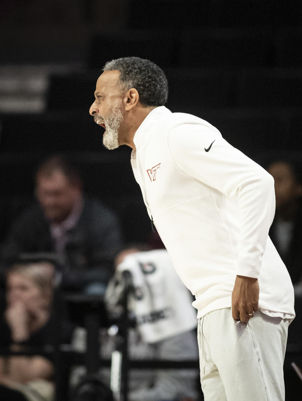 Virginia Tech head coach Kenny Brooks directs his team against Wake Forest in the first half of an NCAA college basketball game Thursday, Jan. 4, 2024, in Winston-Salem, N.C. (Allison Lee Isley/The Winston-Salem Journal via AP)