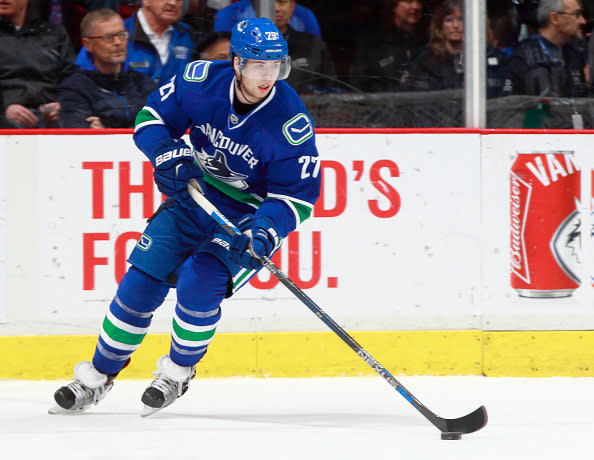 VANCOUVER, BC - DECEMBER 28: Ben Hutton #27 of the Vancouver Canucks skates up ice with the puck during their NHL game against the Los Angeles Kings at Rogers Arena December 28, 2016 in Vancouver, British Columbia, Canada. (Photo by Jeff Vinnick/NHLI via Getty Images)'n