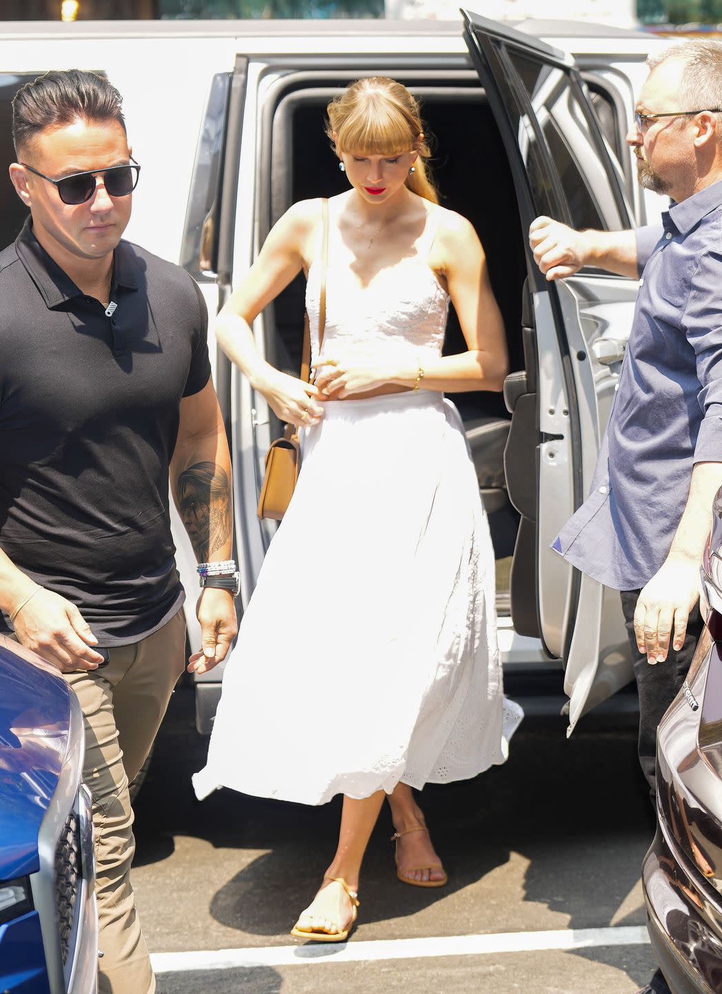 Taylor Swift Ushers in Summer Style With a White Bustier Crop Top and Skirt