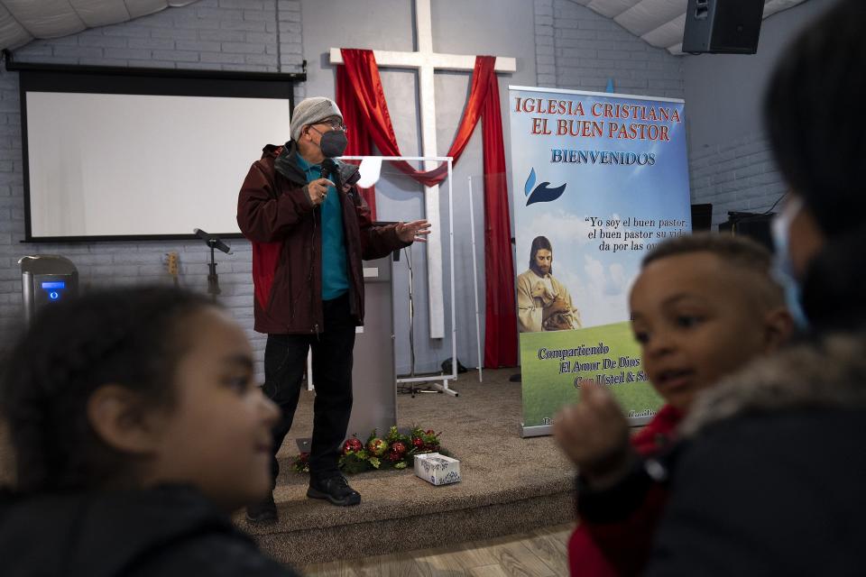 Pastor Hector Ramirez directs a group of migrants on what to do before and after reaching their final destinations in the U.S. at Iglesia Cristiana El Buen Pastor on Thursday, Dec. 22, 2022, in Mesa. The church was burglarized on Jan. 23, 2023.