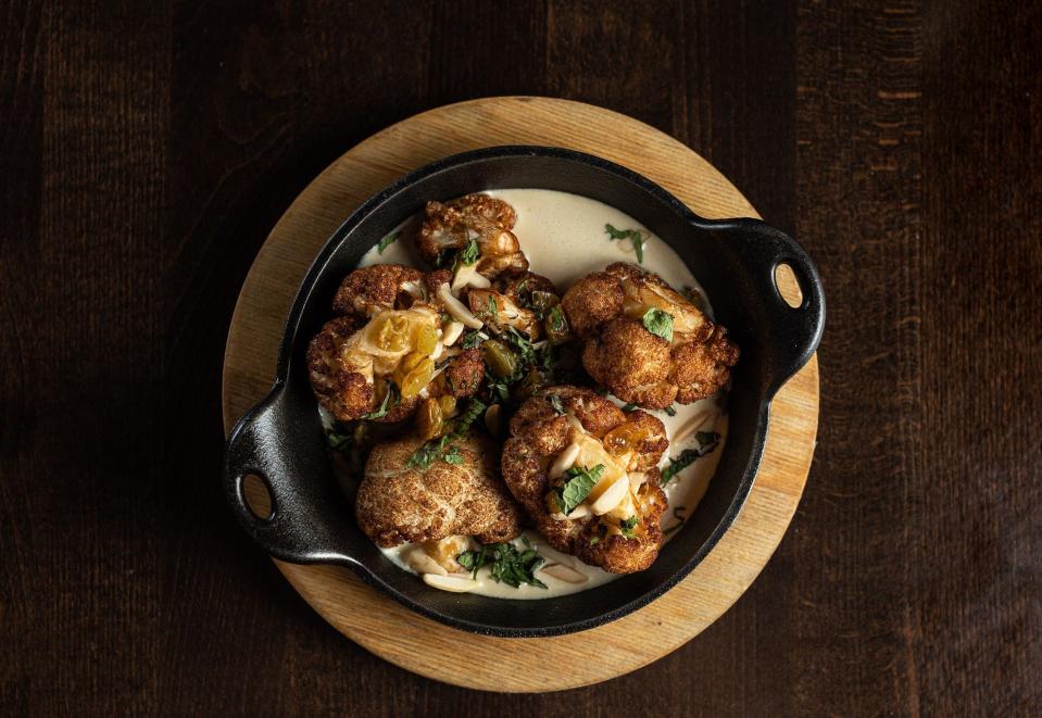 On the menu at the renewed Corvina Seafood Grill: roasted cauliflower with lemon tahini, toasted almonds and golden raisins.