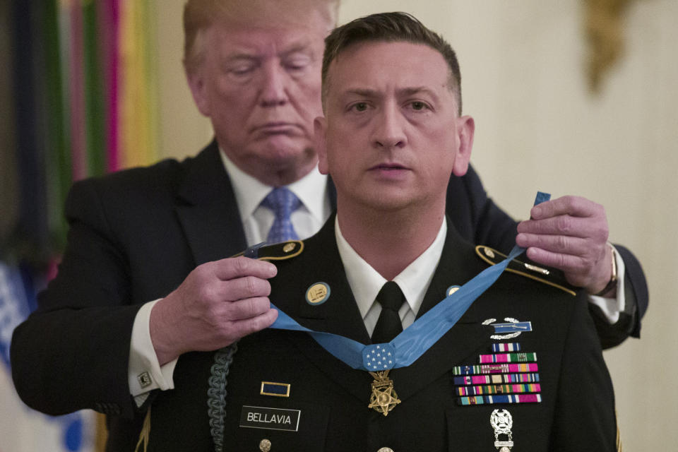 President Donald Trump awards the Medal of Honor to Army Staff Sgt. David Bellavia in the East Room of the White House in Washington, Tuesday, June 25, 2019, for conspicuous gallantry while serving in support of Operation Phantom Fury in Fallujah, Iraq. (AP Photo/Alex Brandon)