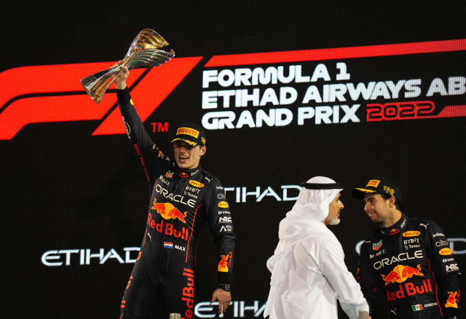 Formula One F1 - Abu Dhabi Grand Prix - Yas Marina Circuit, Abu Dhabi, United Arab Emirates - November 20, 2022 Red Bull's Max Verstappen celebrates with a trophy on the podium after winning the Abu Dhabi Grand Prix REUTERS/Aleksandra Szmigiel