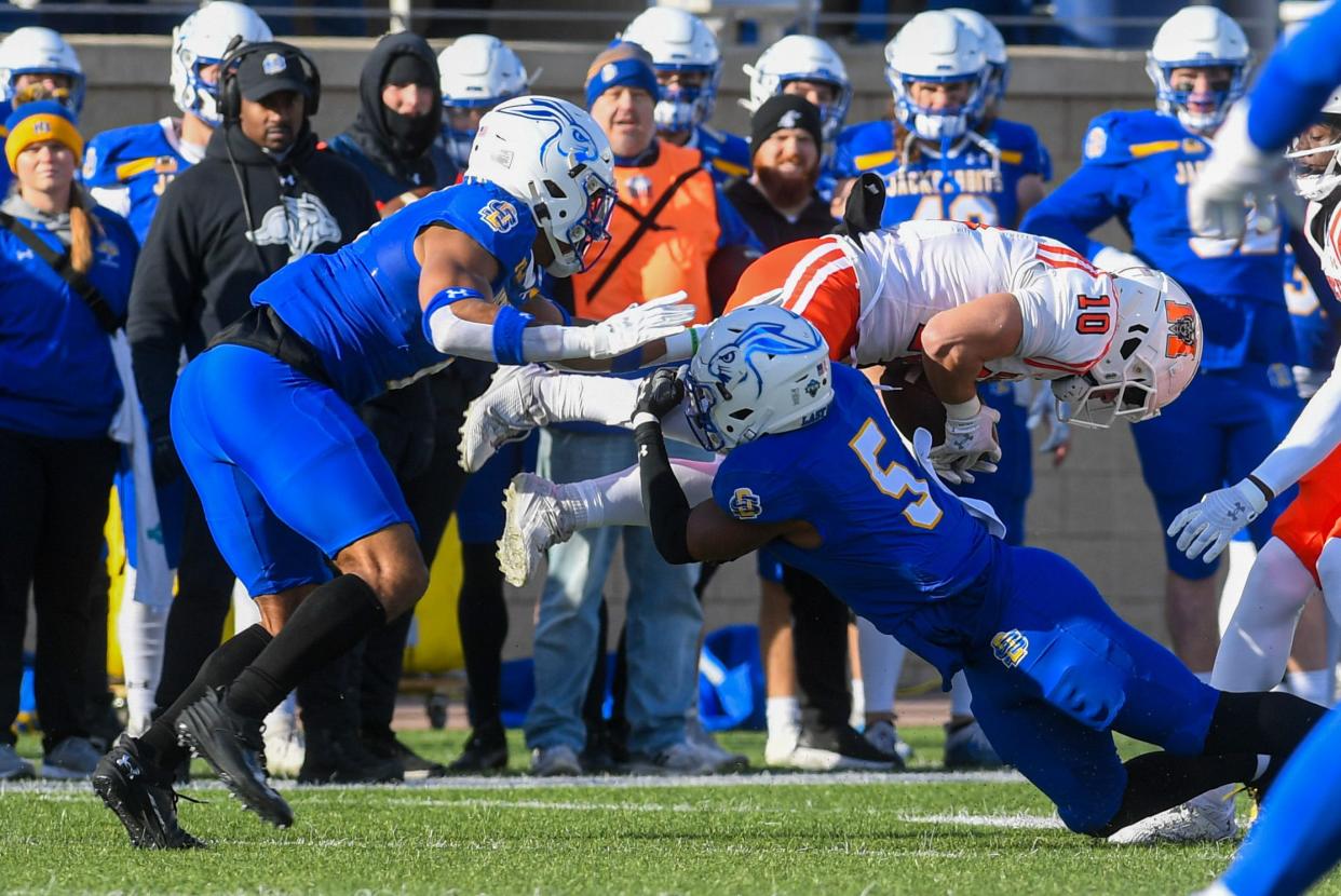 SDSU's cornerback DyShawn Gales (5) tackles Mercer's wide receiver Parker Wroble (10) on Saturday, Dec. 2, 2023 at Dana J Dykhouse Stadium in Brookings.