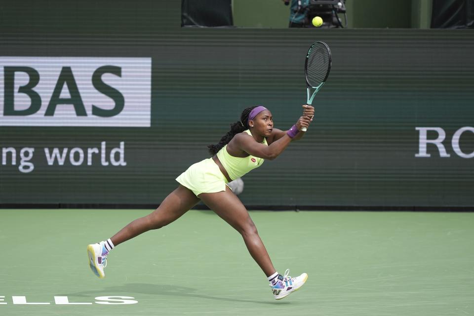 Coco Gauff, of the United States, returns a shot to Lucia Bronzetti, of Italy, at the BNP Paribas Open tennis tournament Monday, March 11, 2024, in Indian Wells, Calif. (AP Photo/Mark J. Terrill)