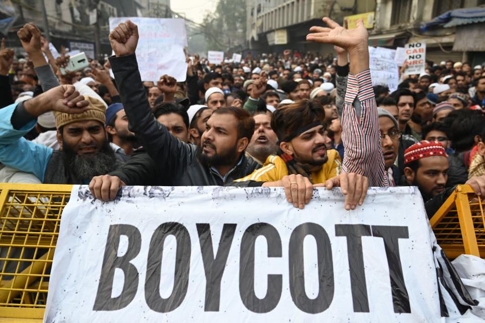 Protesters shout slogans at a demonstration against Indias new citizenship law in New Delhi on December 20, 2019. - Fresh clashes between Indian police and demonstrators erupted on December 20 after more than a week of deadly unrest triggered by a citizenship law seen as anti-Muslim. (Photo by Money SHARMA / AFP) (Photo by MONEY SHARMA/AFP via Getty Images)