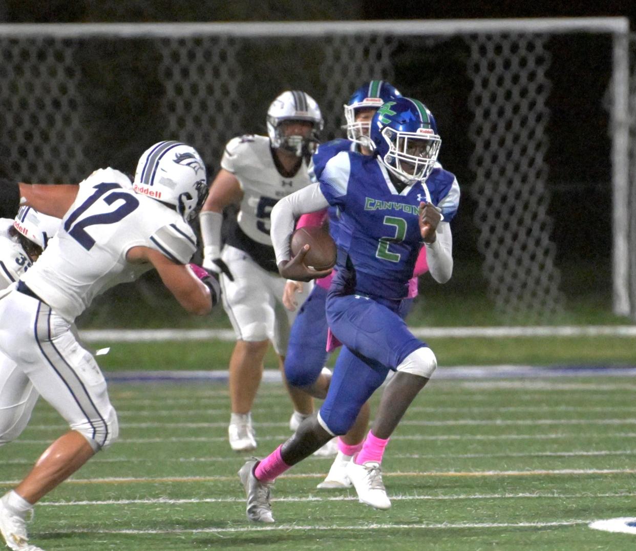 Somerset’s Jayden Harrington scrambles for yardage on a play against American Heritage on Oct. 13, 2023.