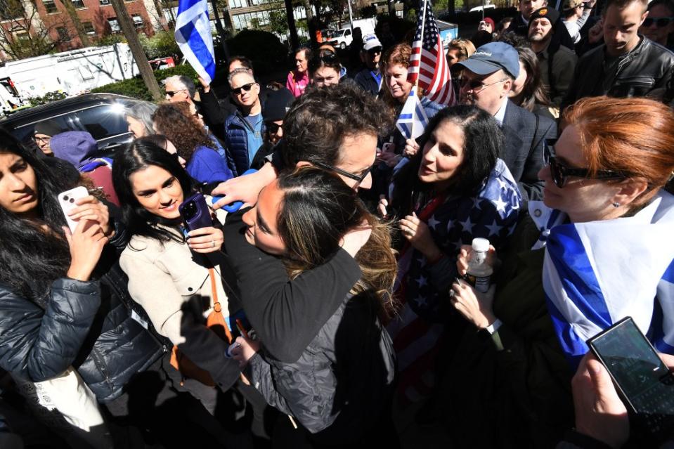 Davdai (center) embraces a supporter outside Columbia University. Matthew McDermott