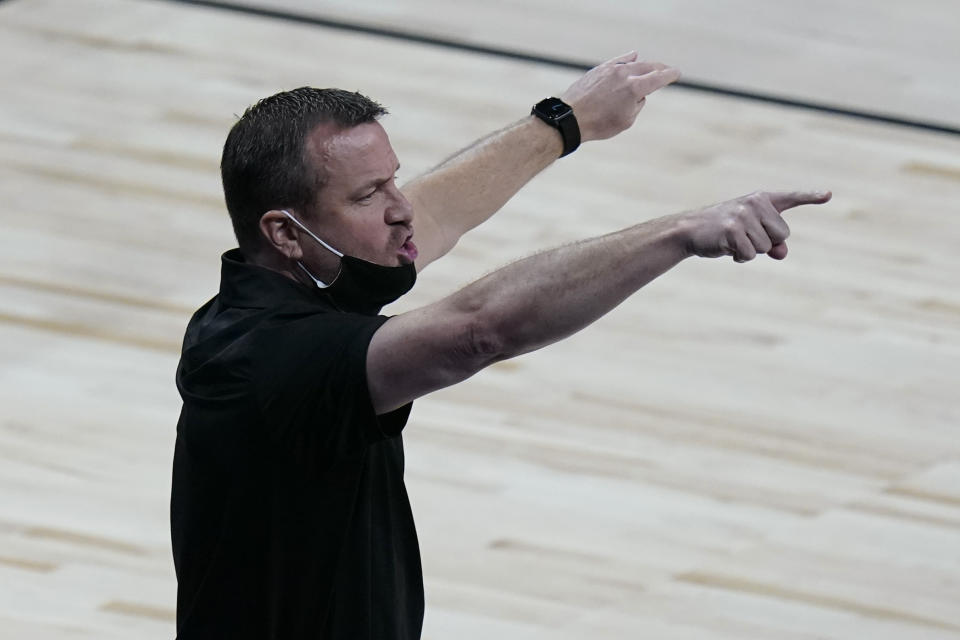 Louisville head coach Jeff Walz gives direction to his players during the first half of a college basketball game against Oregon in the Sweet Sixteen round of the women's NCAA tournament at the Alamodome in San Antonio, Sunday, March 28, 2021. (AP Photo/Eric Gay)