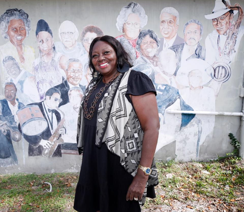 Althea Ross-Chavers, director of the Lacey Family/Spring Hill Boys & Girls Club, stands Wednesday, Nov. 30, in front of the older building that will be torn down and replaced next year with a space just for the club's teens, which will bear the longtime director's name.