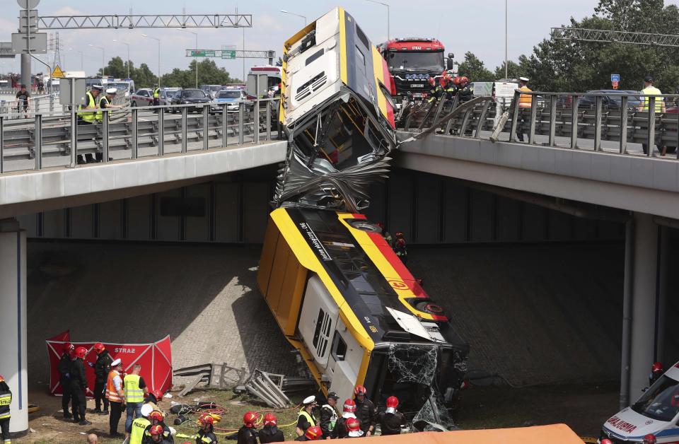 The wreckage of a Warsaw city bus is shown after the articulated bus crashed off an overpass, killing one person and injuring about 20 people, in Warsaw, Poland, on June 25, 2020. The accident forced Warsaw Mayor Rafal Trzaskowski, who is a runner-up candidate in Sunday presidential election, to suspend his campaigning.(AP Photo/Czarek Sokolowski)